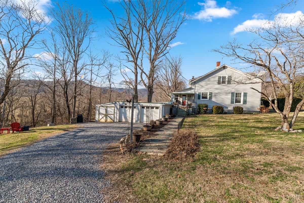 1045 Thrashers Creek Road Amherst, VA 24521 - Photo 29 of 54 a front view of a house with a yard