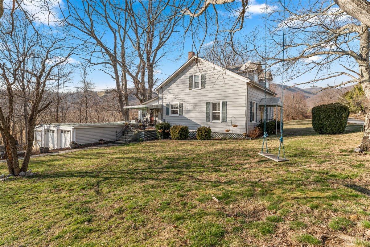 1045 Thrashers Creek Road Amherst, VA 24521 - Photo 34 of 54 a front view of a house with a yard