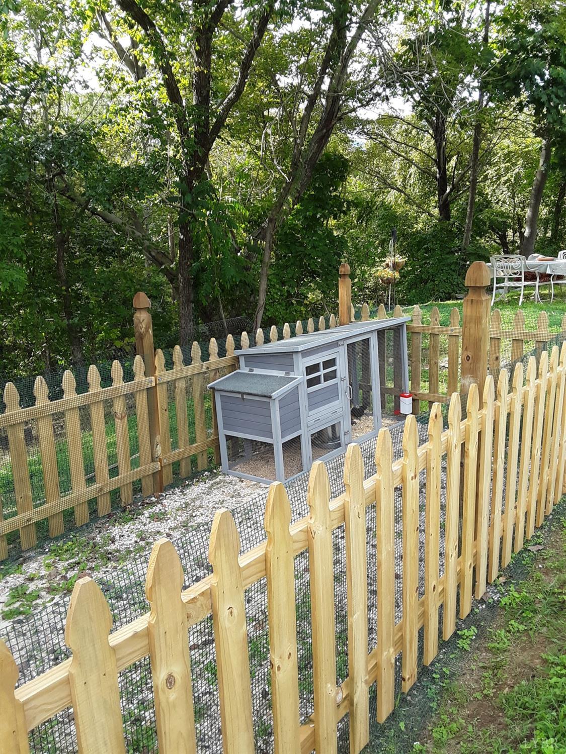 1045 Thrashers Creek Road Amherst, VA 24521 - Photo 47 of 54 a wooden fence with trees in the background