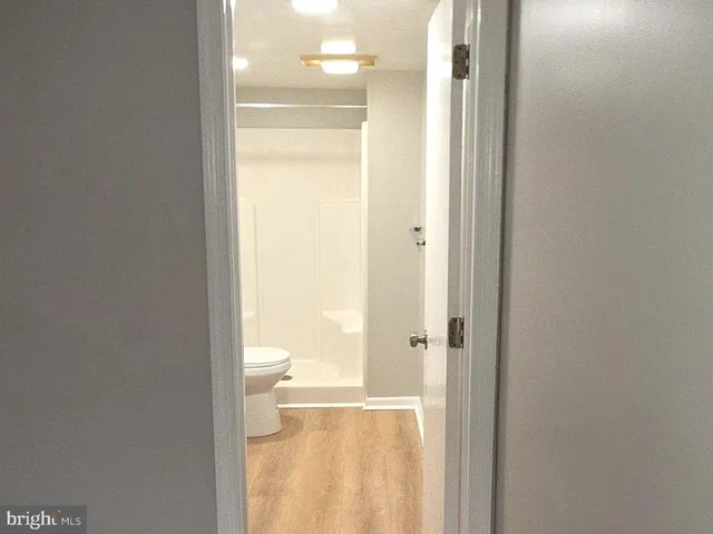 a bathroom with a glass shower door