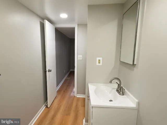 a bathroom with a sink and mirror