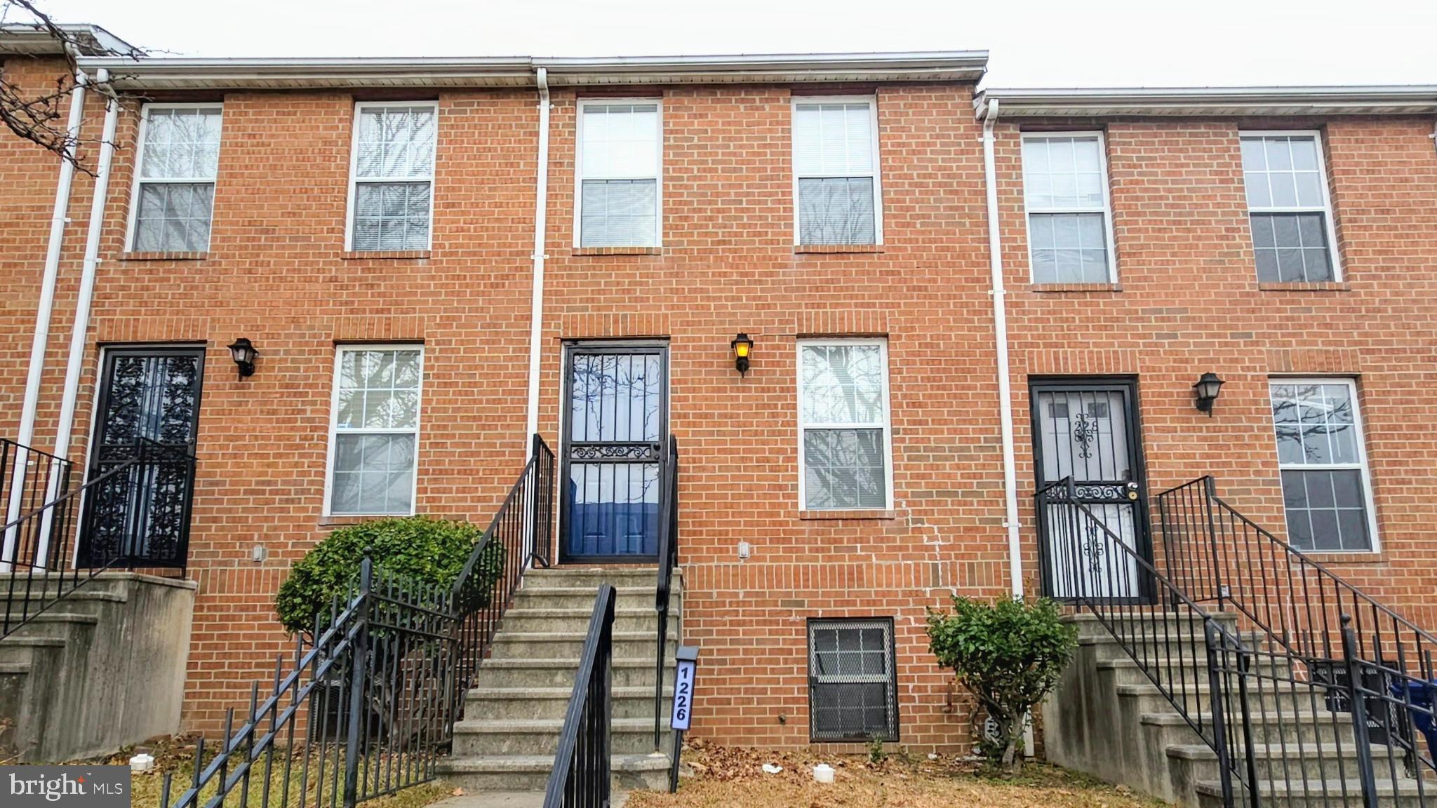 1226 East Chase Street Baltimore, MD 21202 - Photo 2 of 41 Charming brick townhomes with inviting steps.
