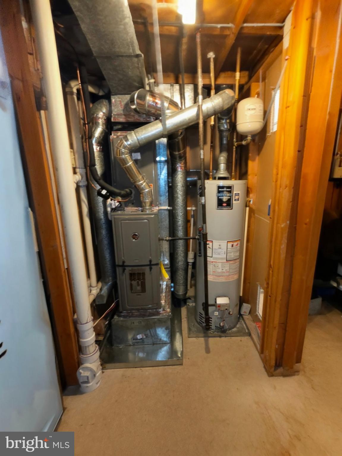 1226 East Chase Street Baltimore, MD 21202 - Photo 33 of 41 Utility space with heating and water systems.