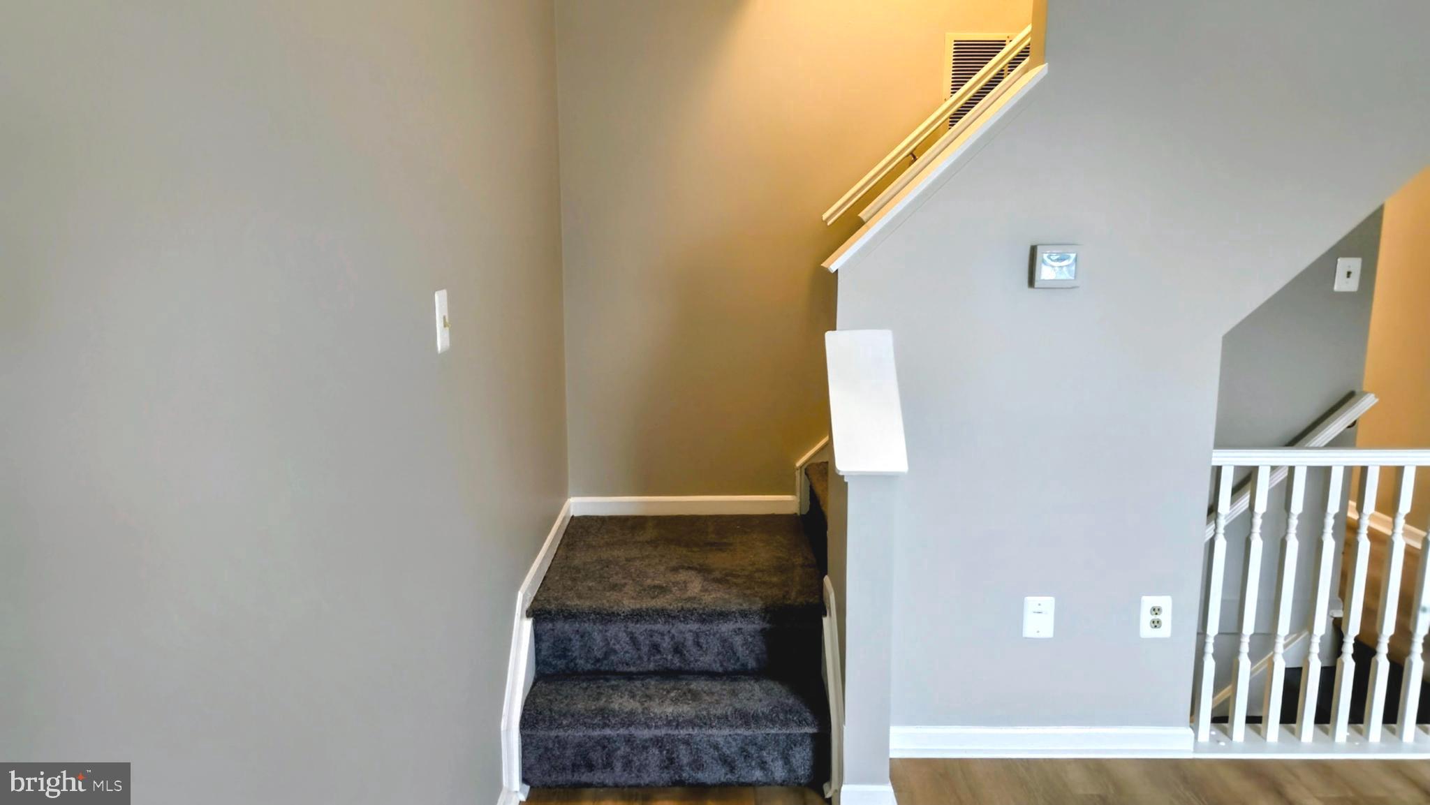 1226 East Chase Street Baltimore, MD 21202 - Photo 6 of 41 Main level stars leading to upper level.