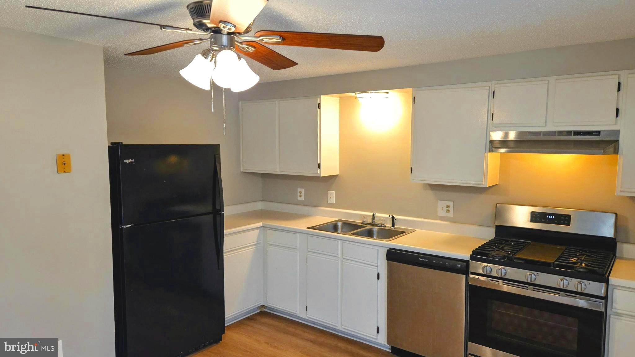 1226 East Chase Street Baltimore, MD 21202 - Photo 8 of 41 Modern kitchen with sleek appliances.