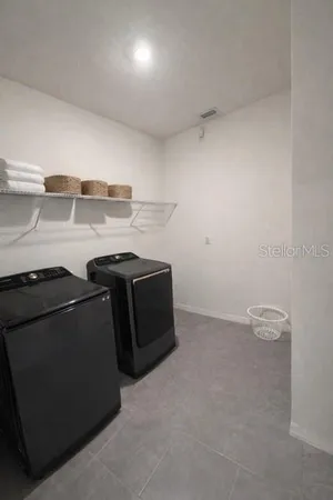 a utility room with dryer and washer