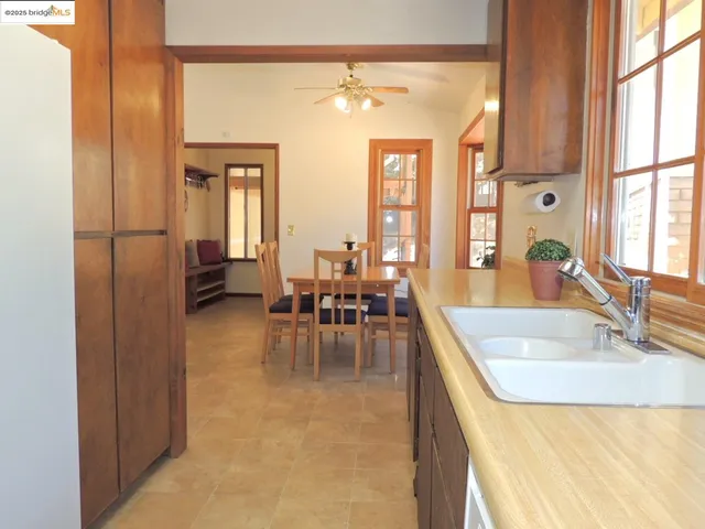 a kitchen with stainless steel appliances granite countertop a sink stove and microwave