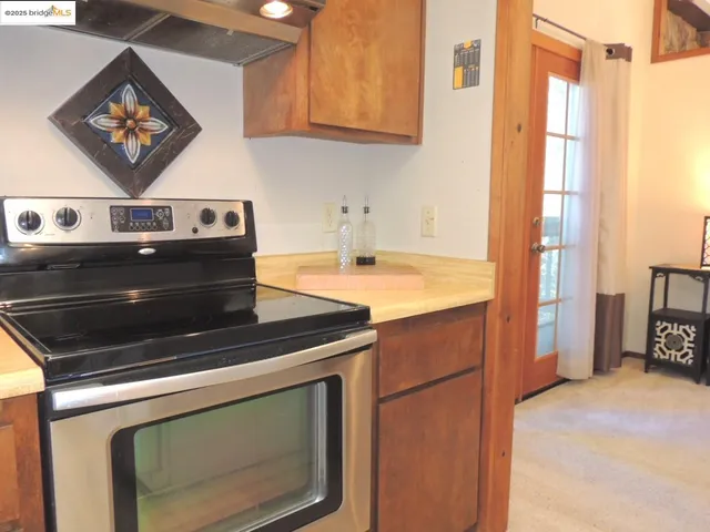 a view of a dining room with a table and chairs