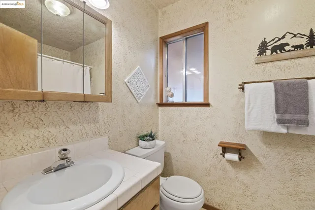 a bedroom with a bed and a table