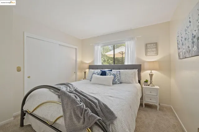 a bedroom with a bed and a view of bathroom