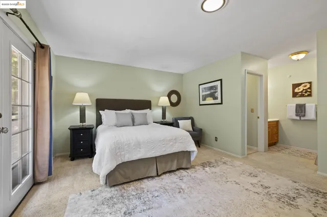 a room with pool table and windows