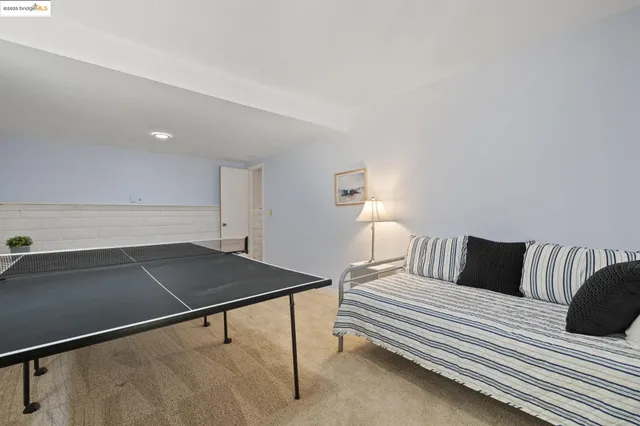an aerial view of house with yard and mountain view in back