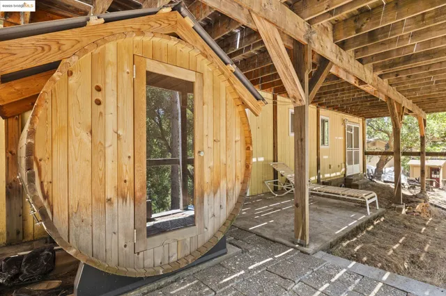 a room with pool table and chairs