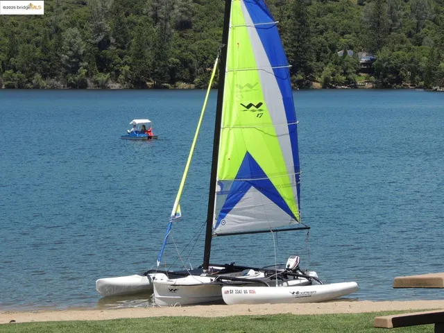 a view of a swimming pool with a bench and wooden floor