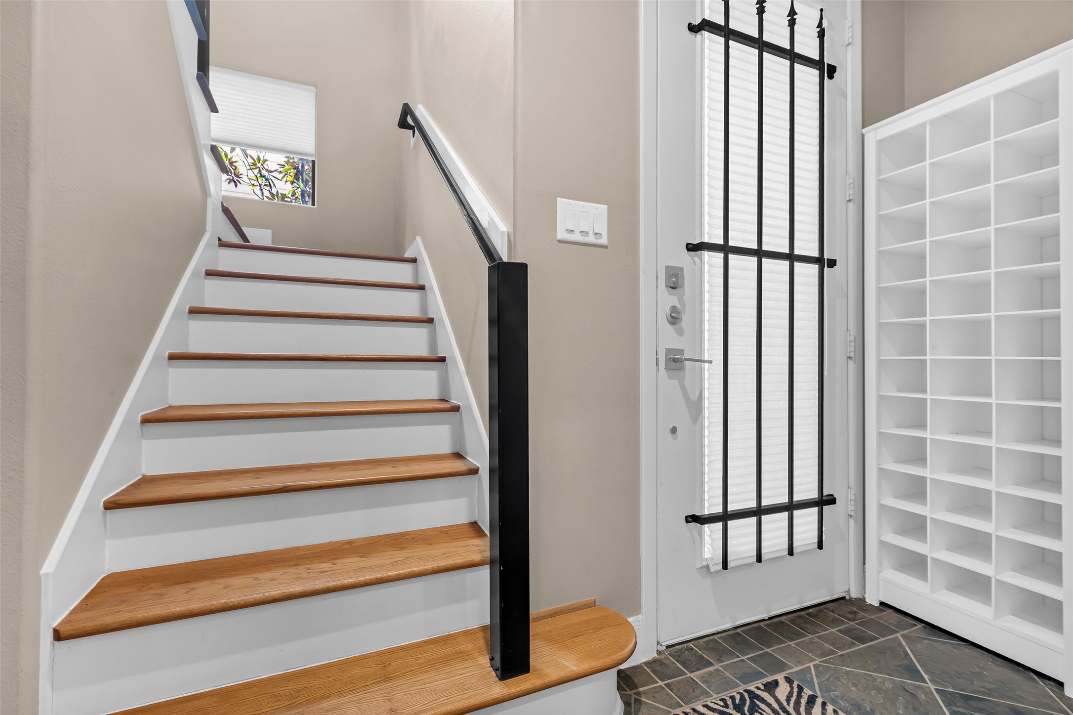 2413 Ralph Street, Unit 2 Houston, TX 77006 - Photo 18 of 26 a view of staircase with white walls and railing