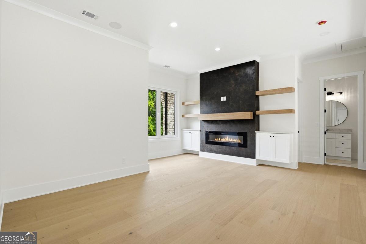 1557 Whitley Road Dacula, GA 30019 - Photo 26 of 46 a view of an empty room with a fireplace and a window
