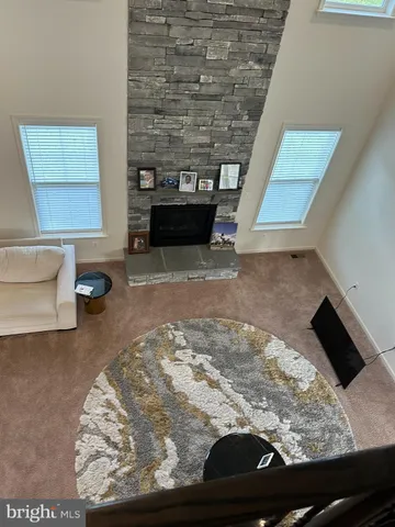 a living room with a rug