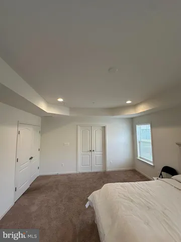 a room with a bed and a window