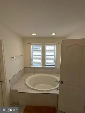 a bathroom with a toilet and a window