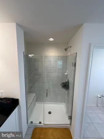 a en suite bathroom with a tub sink and mirror