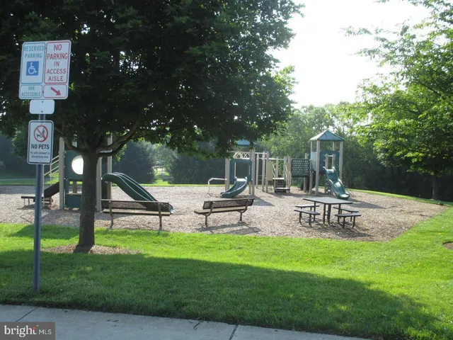 a view of a park with swings and slides