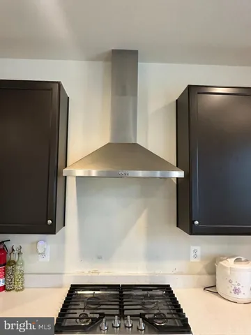 a kitchen with a stainless steel appliances and cabinets