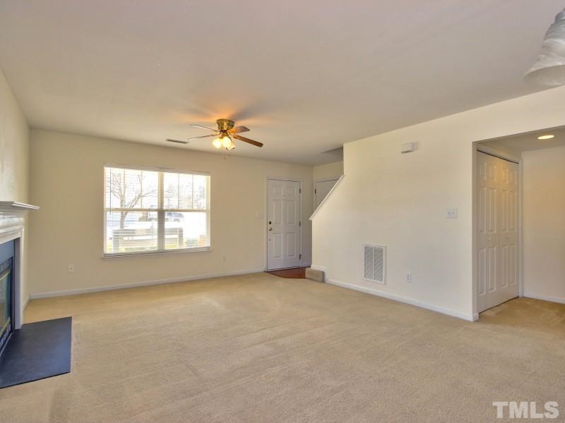 4221 Hopper Street Raleigh, NC 27616 - Photo 3 of 25 a view of an empty room with a window