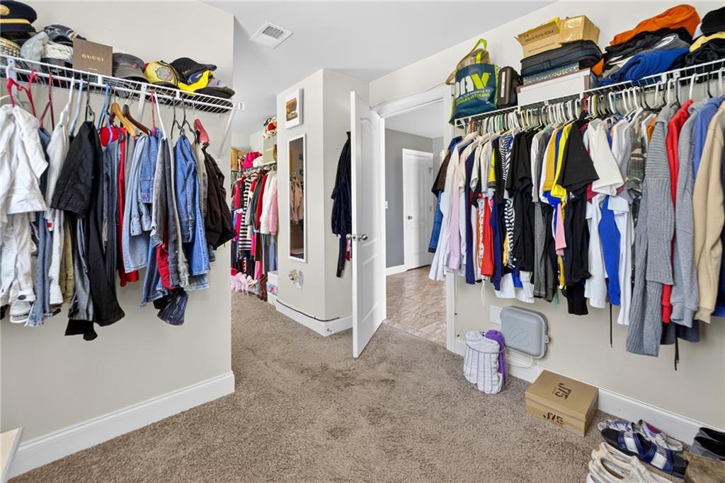 2300 Tucker Mill Road Southwest Conyers, GA 30094 - Photo 25 of 45 a view of walk in closet with clothes
