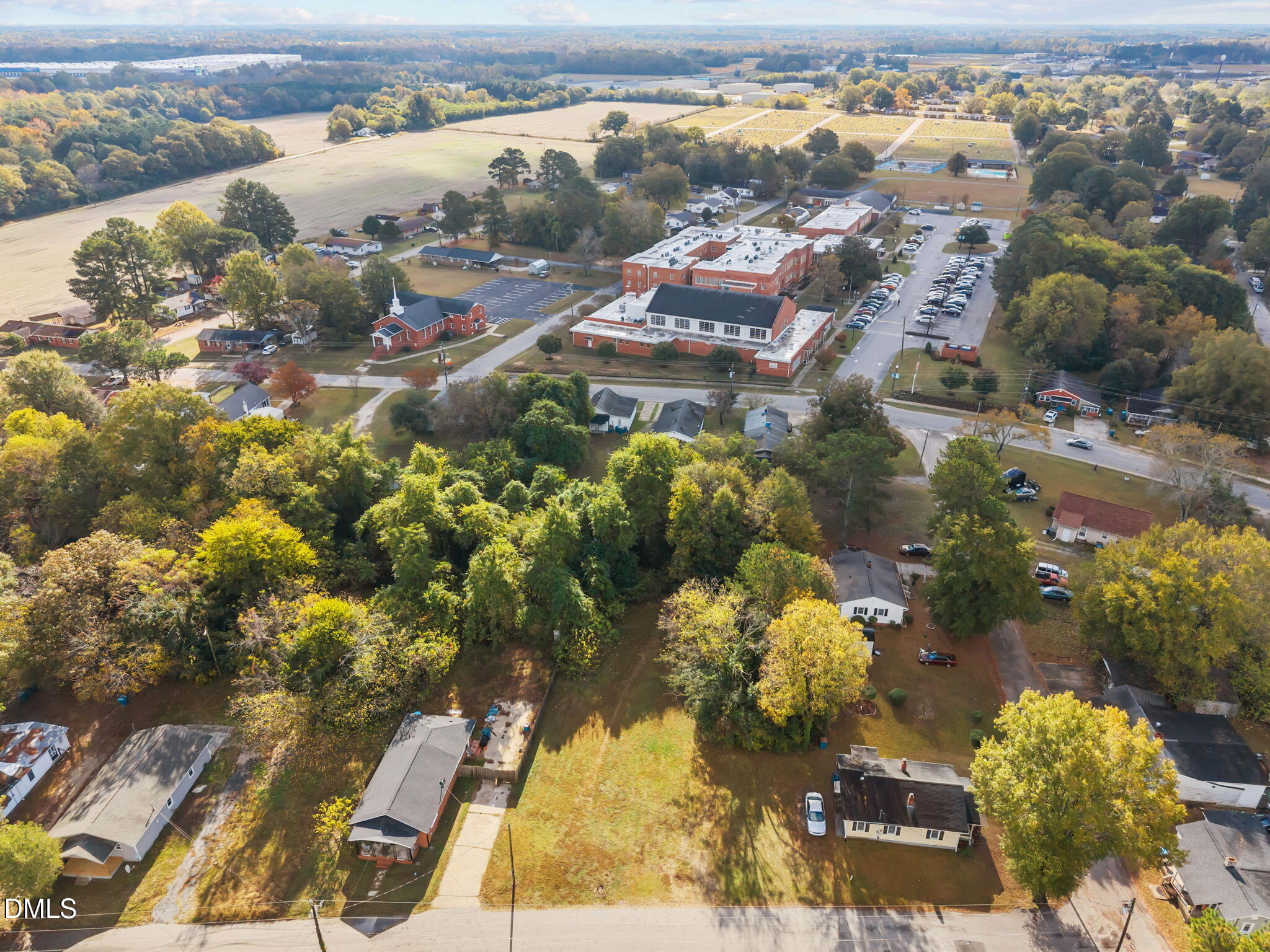102 Jackson Street Dunn, NC 28334 - Photo 14 of 15 an aerial view of residential houses with outdoor space