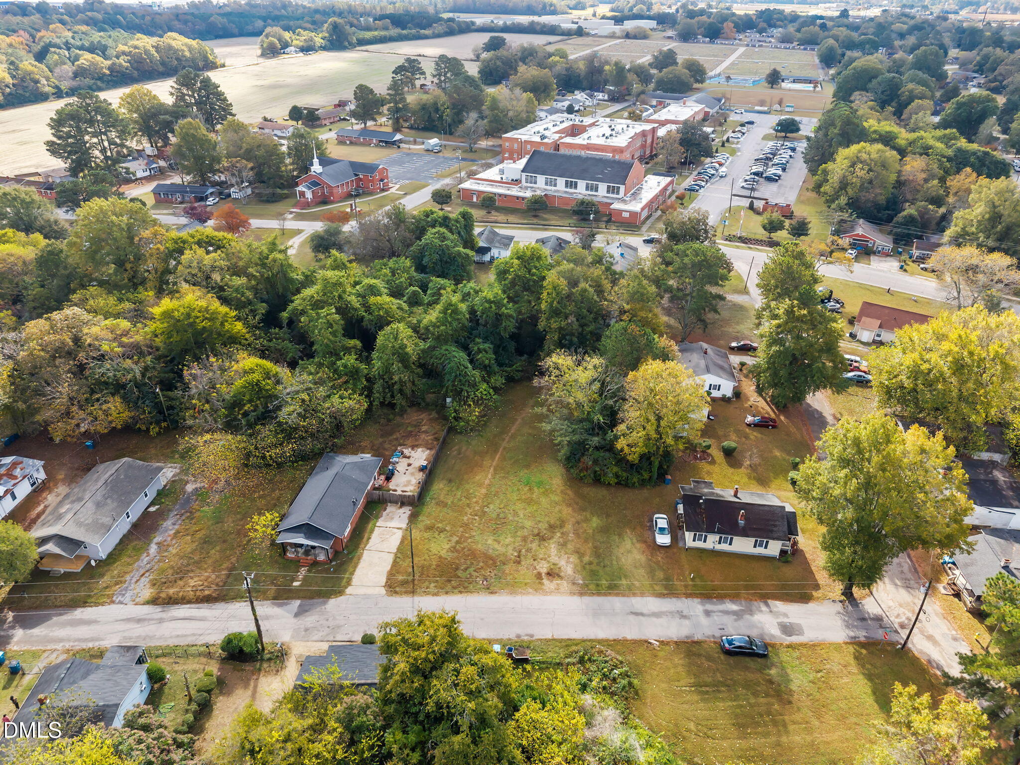 102 Jackson Street Dunn, NC 28334 - Photo 6 of 15 an aerial view of residential houses with outdoor space