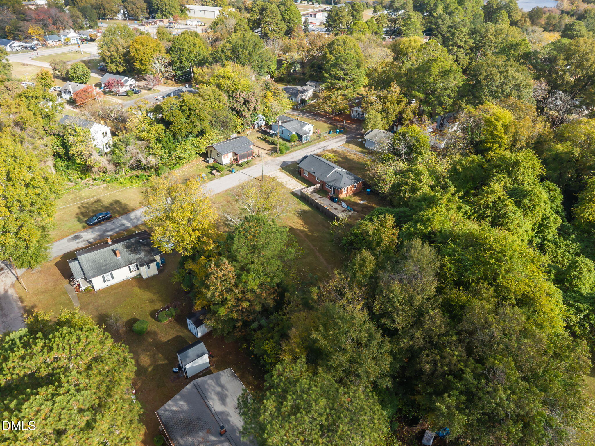 102 Jackson Street Dunn, NC 28334 - Photo 8 of 15 an aerial view of residential houses with outdoor space and trees