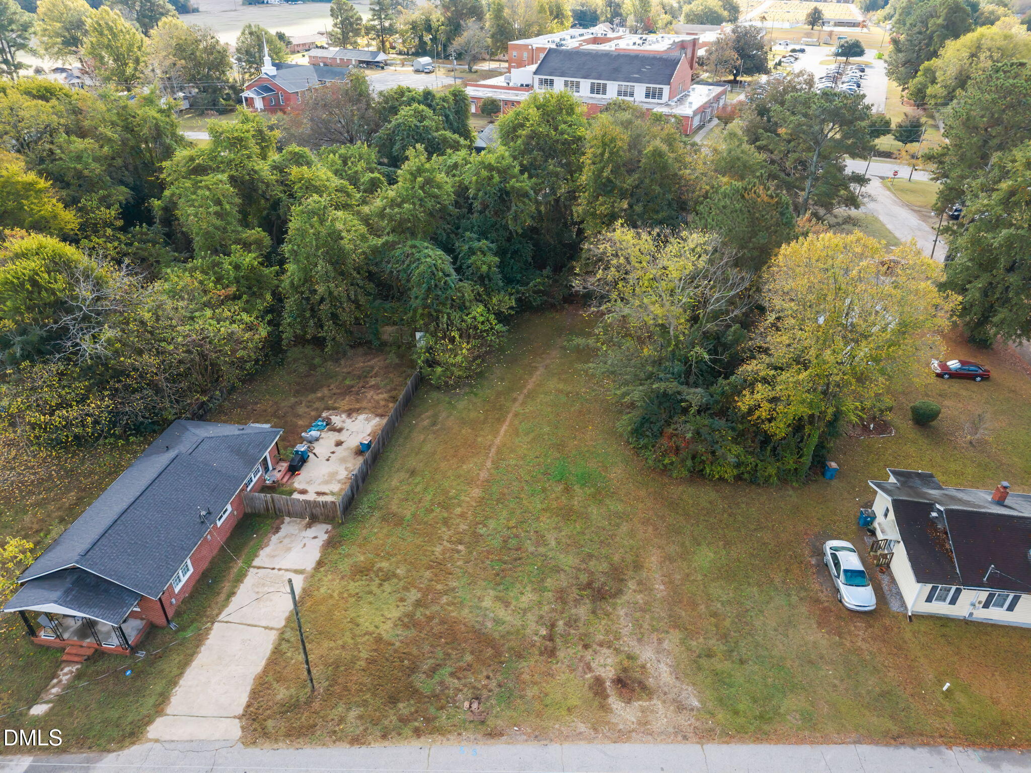 102 Jackson Street Dunn, NC 28334 - Photo 9 of 15 a view of a house with a yard