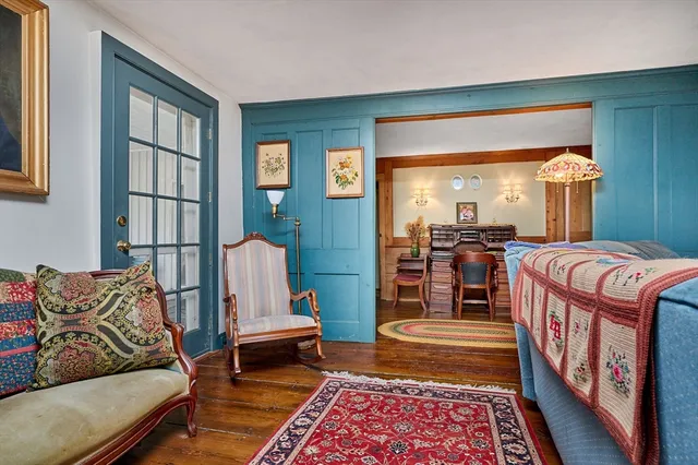 a living room with furniture and a rug
