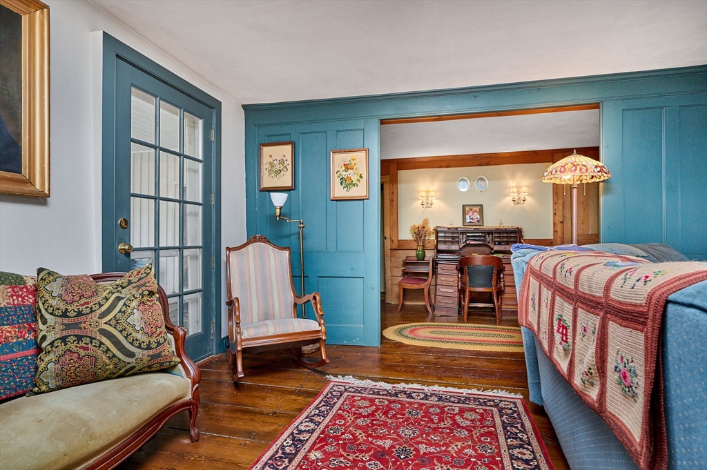 296 Main Street Plainfield, MA 01070 - Photo 11 of 42 a living room with furniture and a rug
