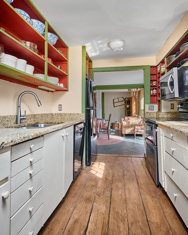 296 Main Street Plainfield, MA 01070 - Photo 17 of 42 a kitchen with granite countertop stainless steel appliances and cabinets