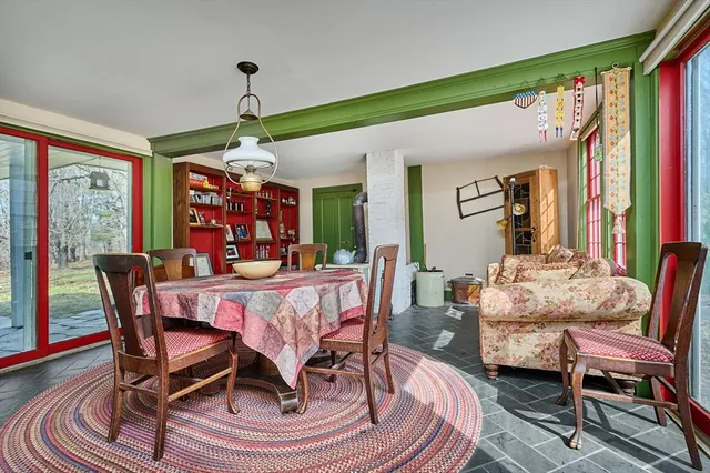 a view of a dining room with furniture window and outside view