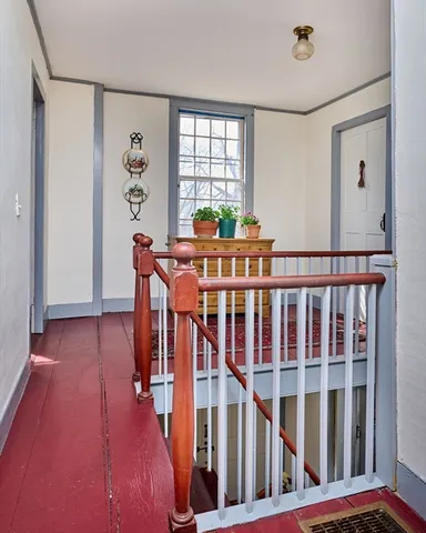 a view of a porch with wooden floor and windows