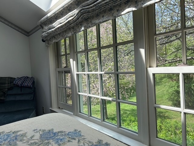 296 Main Street Plainfield, MA 01070 - Photo 31 of 42 a bedroom with a bed and a large window