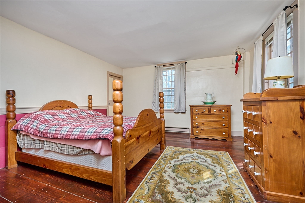296 Main Street Plainfield, MA 01070 - Photo 34 of 42 a bedroom with bed and wooden floor