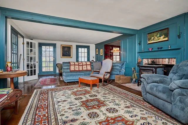 a living room with furniture and a rug