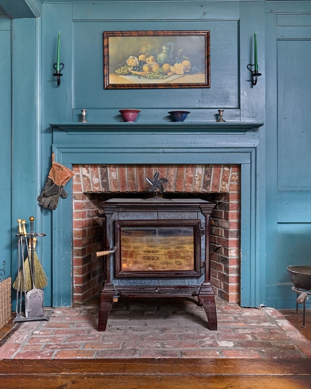 296 Main Street Plainfield, MA 01070 - Photo 10 of 42 a room with furniture and a fireplace