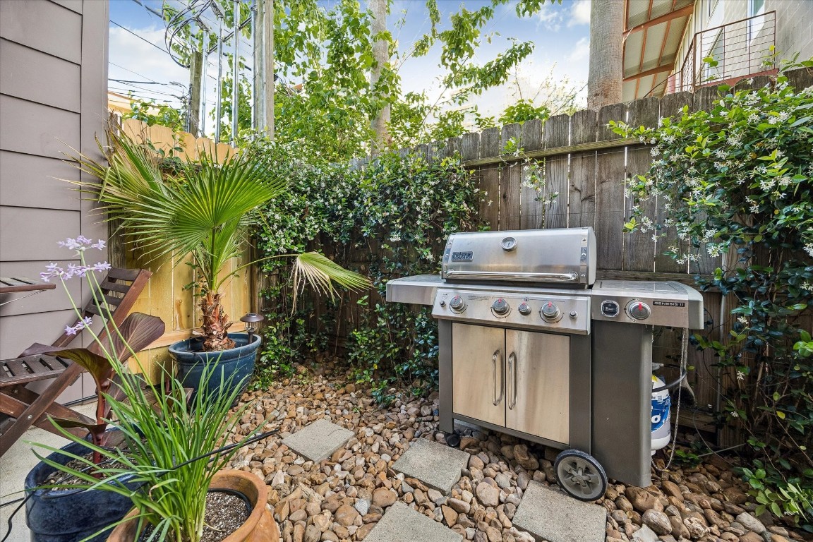 98 Drew Street, Unit A Houston, TX 77006 - Photo 11 of 38 a view of a backyard with chairs and a flower pot