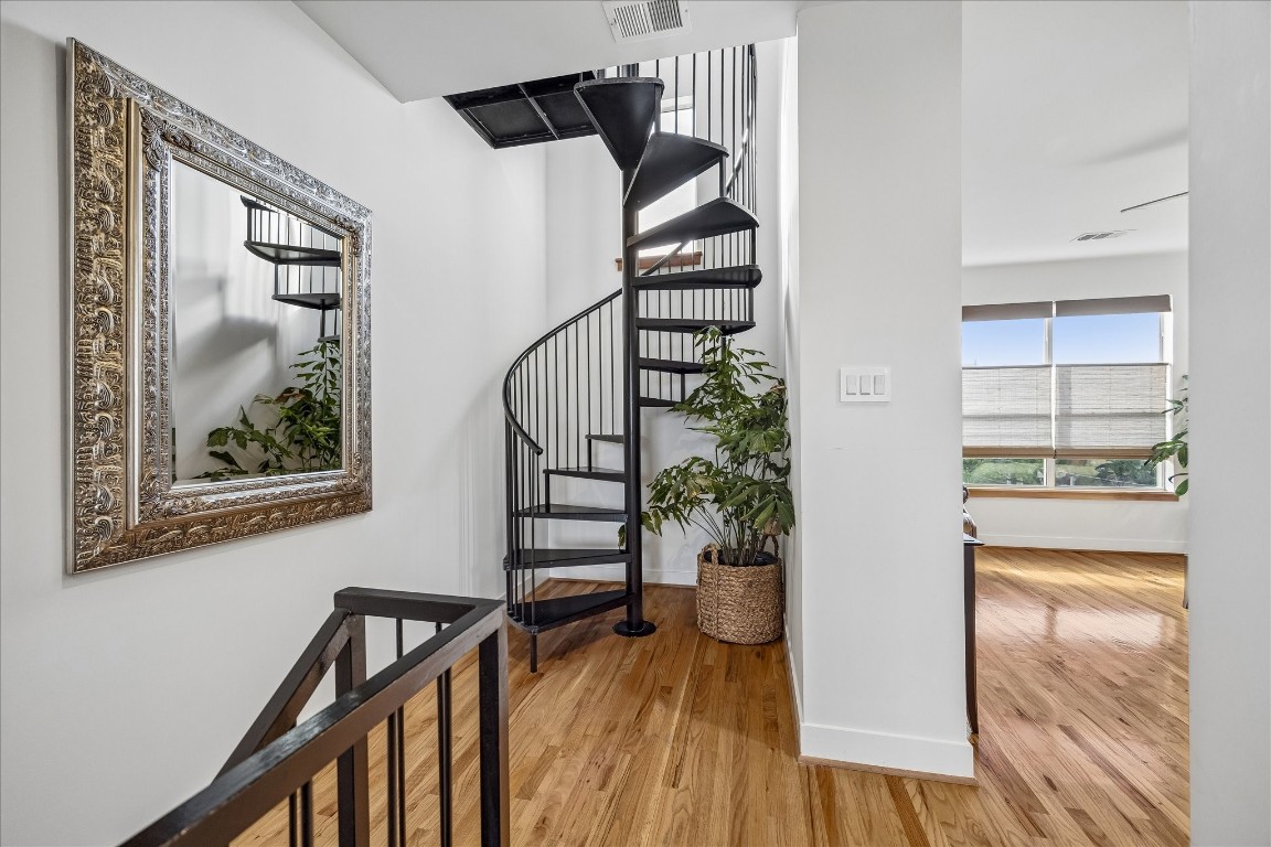 98 Drew Street, Unit A Houston, TX 77006 - Photo 26 of 38 a view of a hallway with wooden floor and staircase