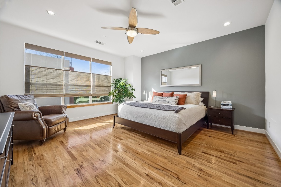 98 Drew Street, Unit A Houston, TX 77006 - Photo 27 of 38 a bed room with a bed window and a chair