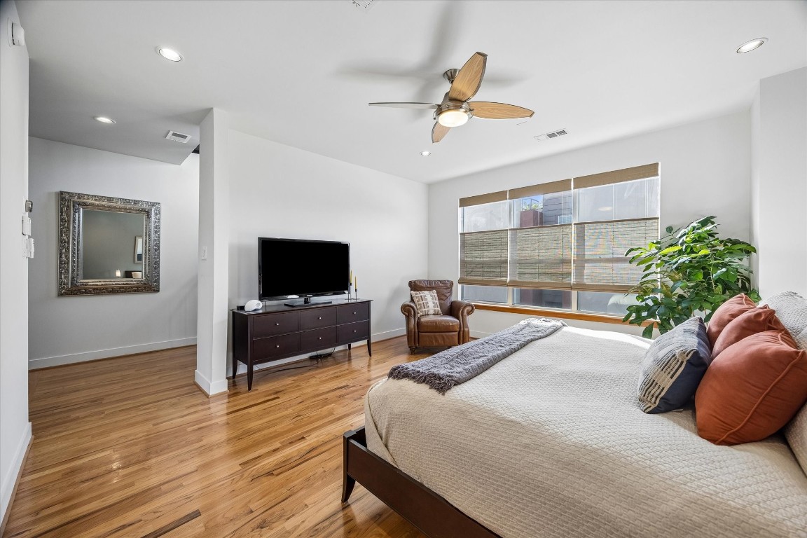 98 Drew Street, Unit A Houston, TX 77006 - Photo 28 of 38 a bedroom with a bed and a flat screen tv