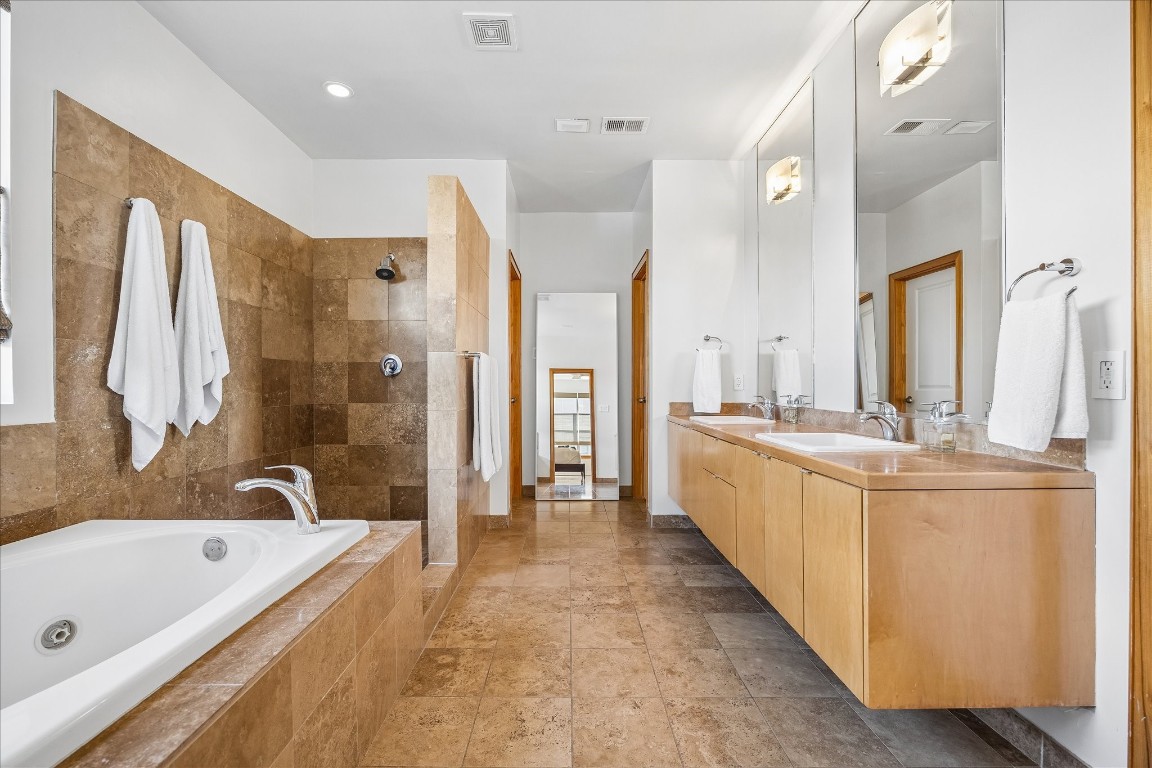 98 Drew Street, Unit A Houston, TX 77006 - Photo 29 of 38 a bathroom with a tub sink and mirror