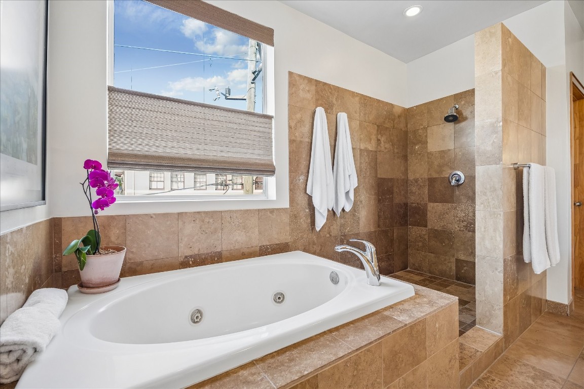 98 Drew Street, Unit A Houston, TX 77006 - Photo 30 of 38 a bathroom with a tub a sink and a shower