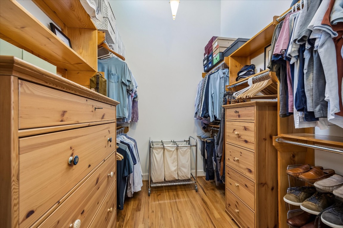 98 Drew Street, Unit A Houston, TX 77006 - Photo 32 of 38 a view of walk in closet with clothes and shoes