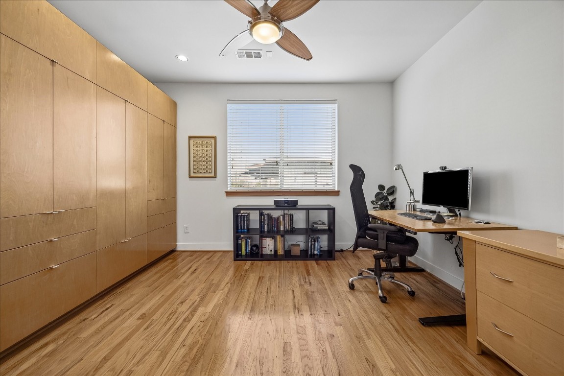 98 Drew Street, Unit A Houston, TX 77006 - Photo 33 of 38 a view of a workspace with furniture and a window