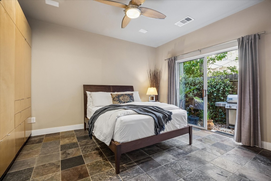 98 Drew Street, Unit A Houston, TX 77006 - Photo 8 of 38 a bed sitting in a bedroom next to a window